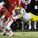 Michigan linebacker Jake Ryan flies through the air to tackle Nebraska  running back Ameer Abdullah in the third quarter against Nebraska at Memorial Stadium in Lincoln, Nebraska on Saturday. Melanie Maxwell I AnnArbor.com